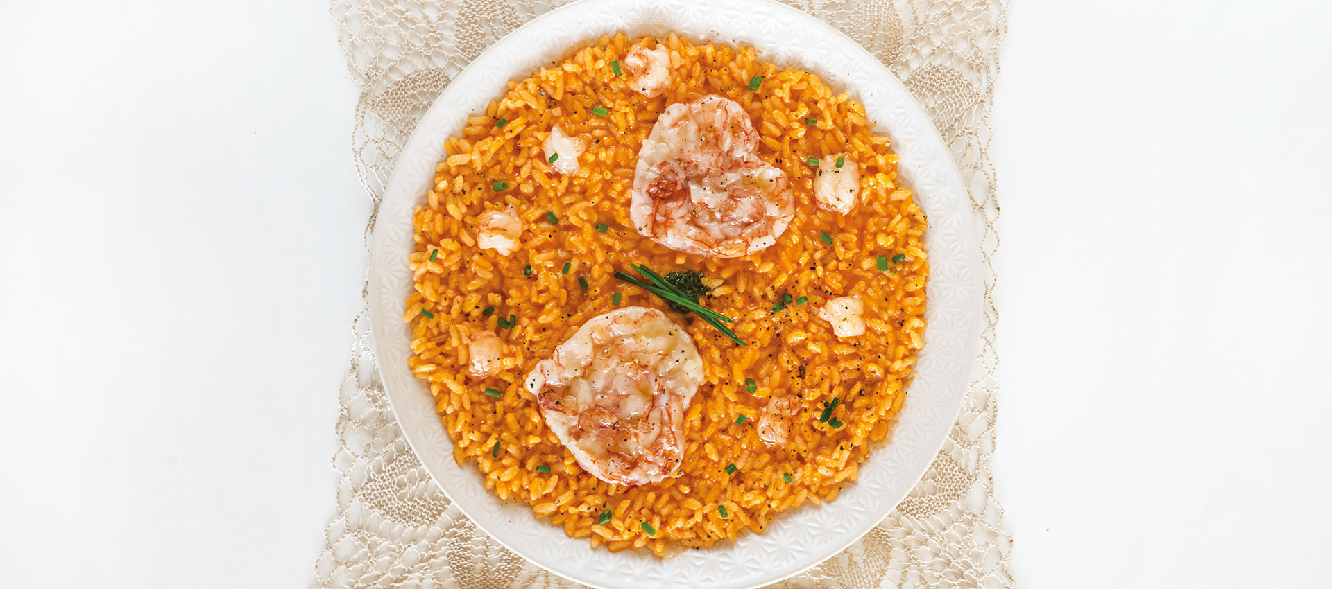 Risotto con bisque e tartare di scampi